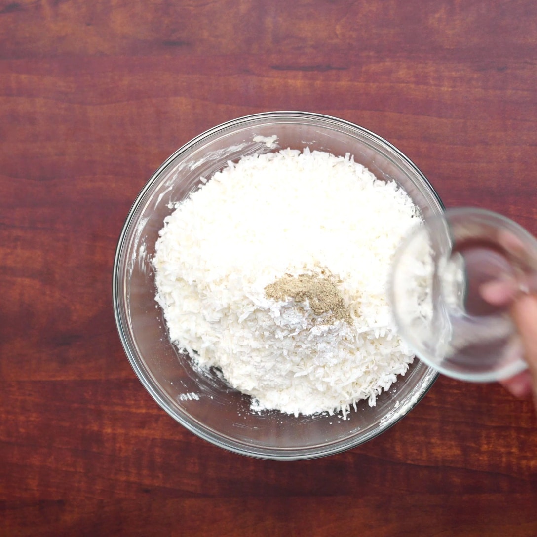 adding flour, flakes, cardamom powder