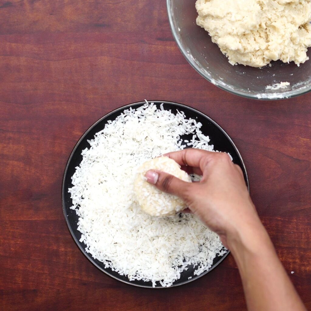 coating dough with coconut flakes