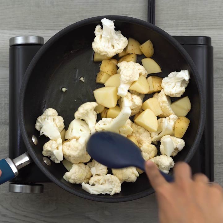 sauting cauliflower and potatoes