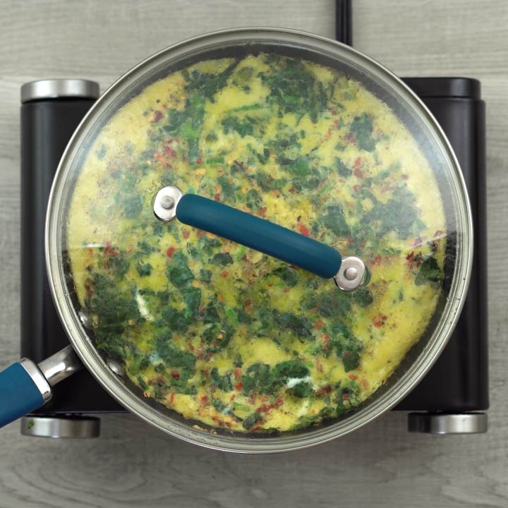 Omelet is cooking with lids closed
