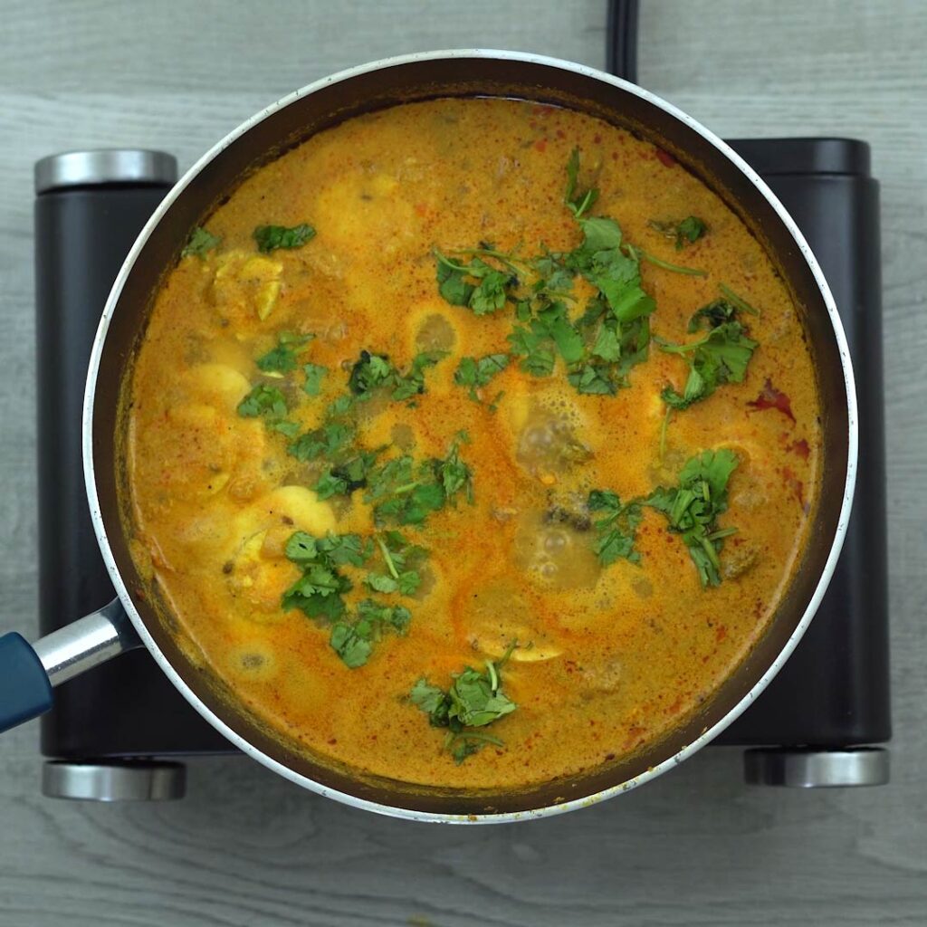 Egg Curry is garnished with coriander leaves