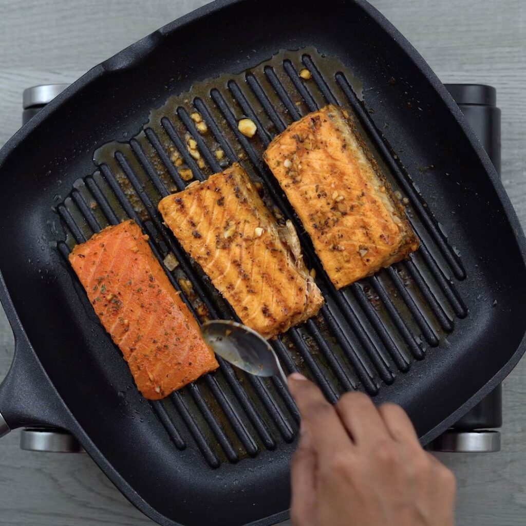 cooking the salmon on both the sides