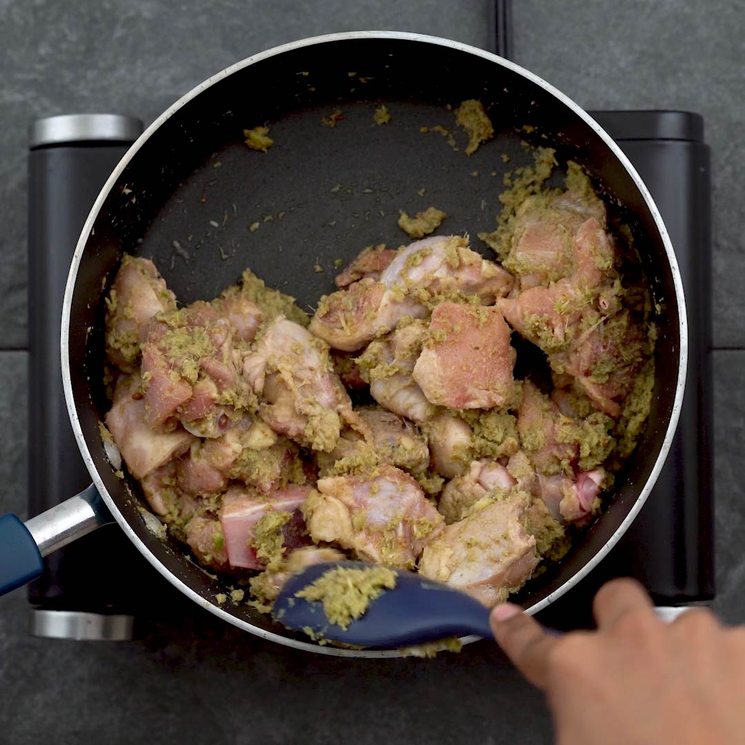 sautéing chicken with green curry paste