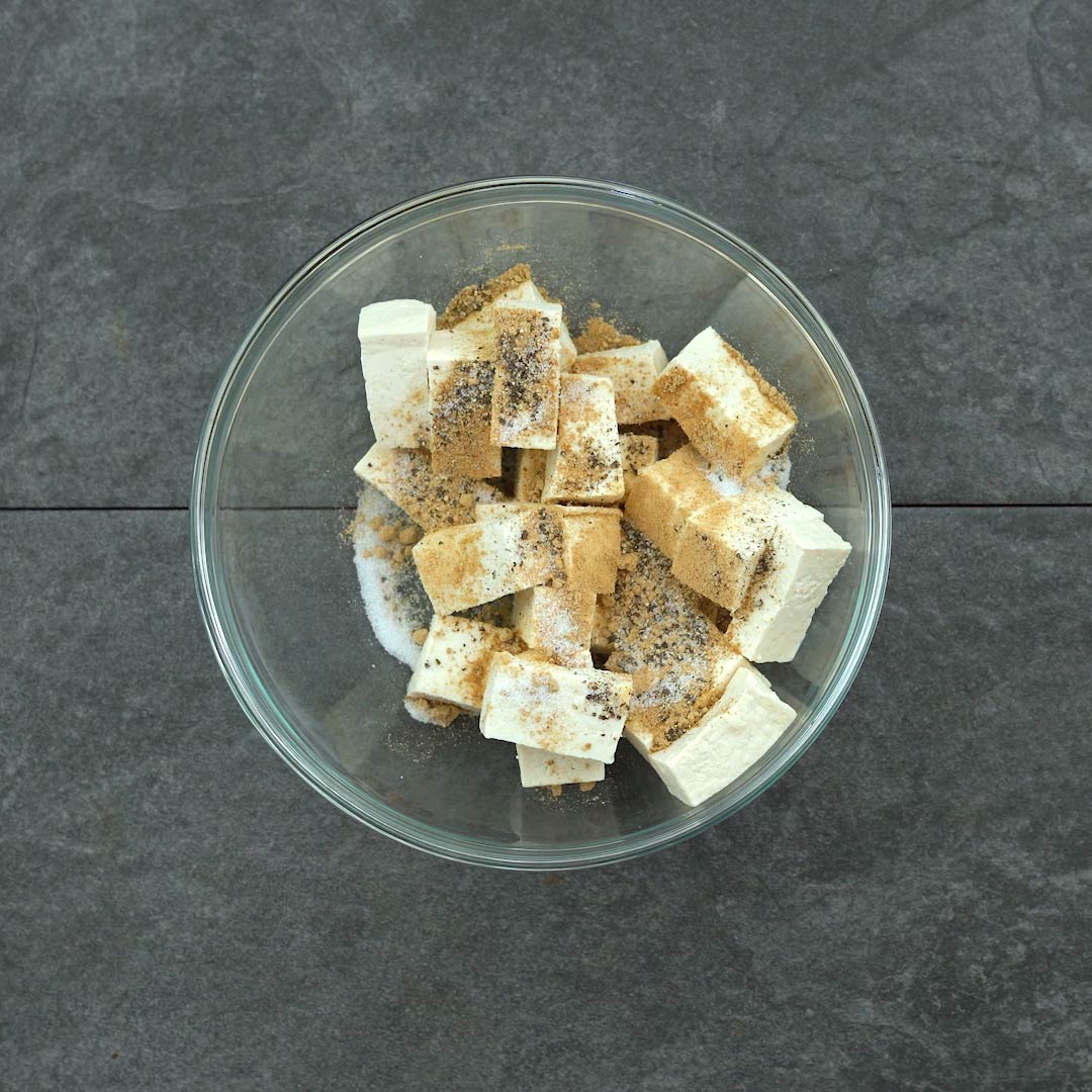 tofu with seasoning powders in a bowl
