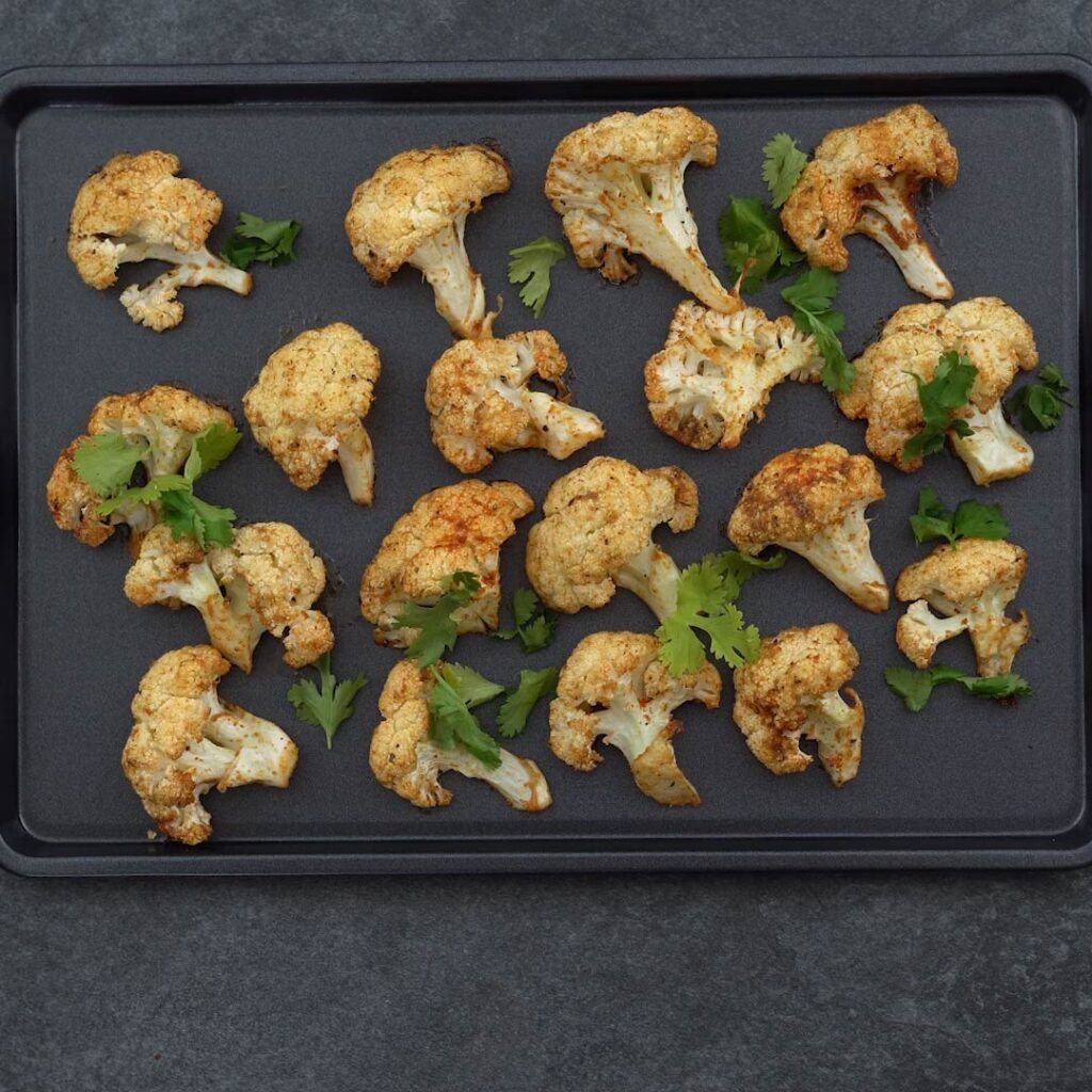Oven Roasted Cauliflower garnished with coriander leaves