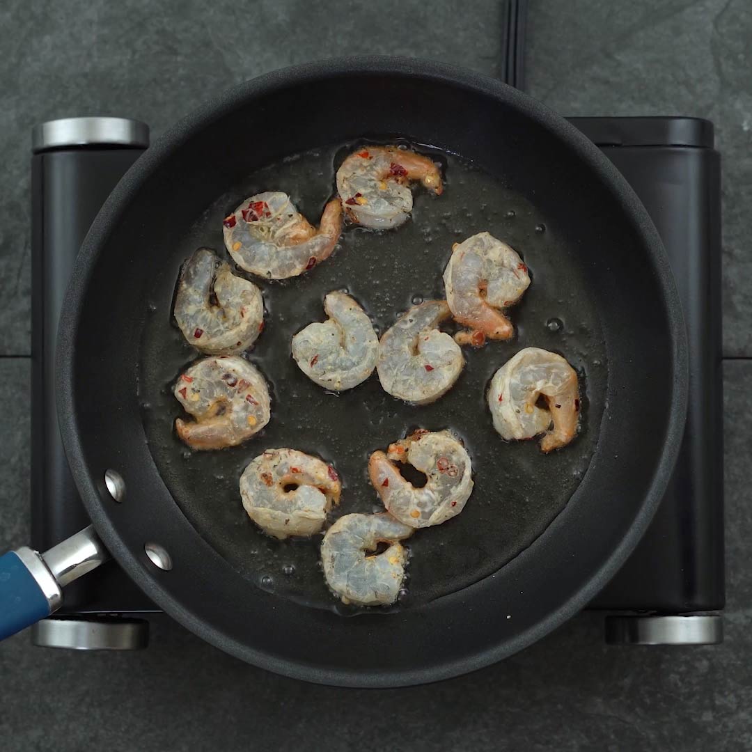 frying shrimp in a pan