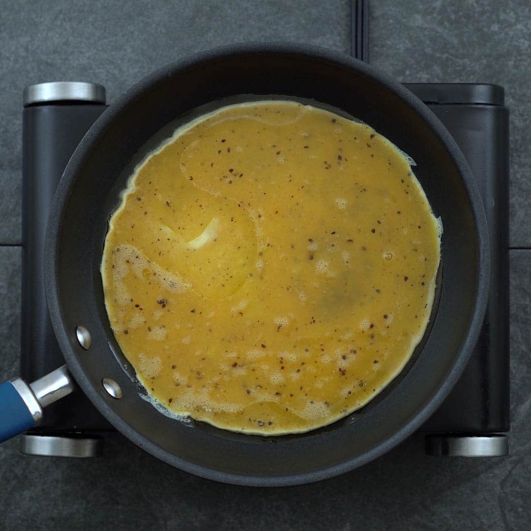 eggs are cooking in a pan