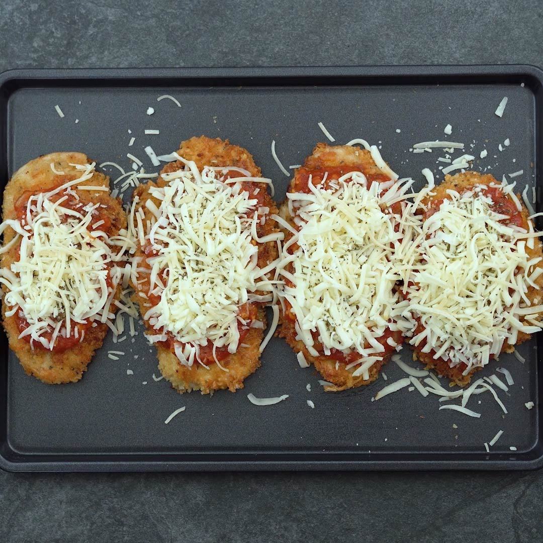 chicken breast topped with mozzarella and parmesan cheese