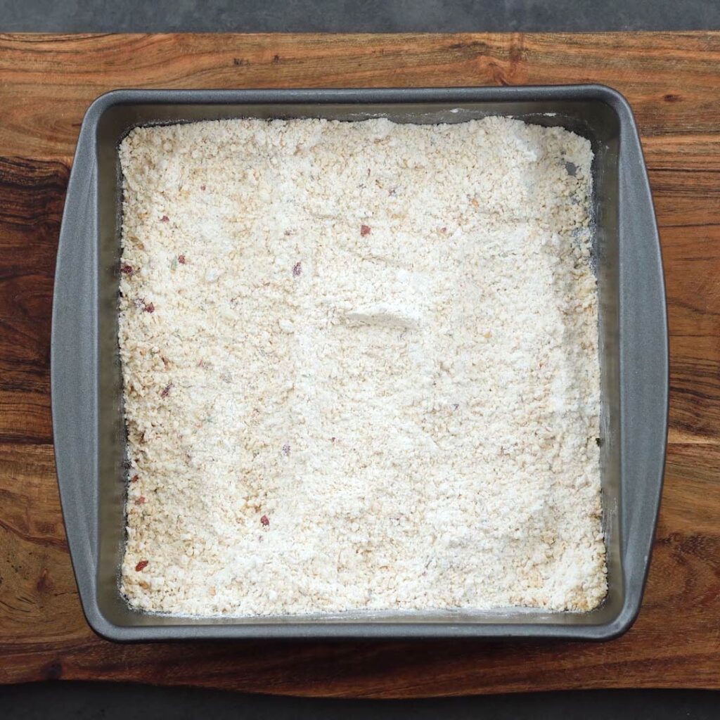 Panko, cheese and flour mix in a tray