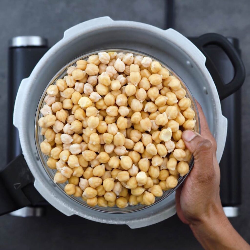 Adding soaked chickpeas in to the pressure cooker
