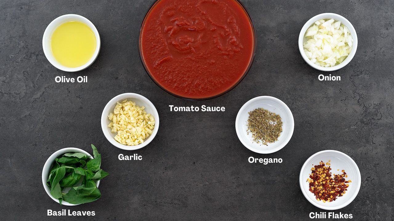Marinara sauce ingredients placed on a gray table